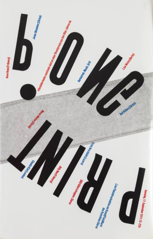 A poster of upside down black texts with red & blue next next to it as a thin grid line is behind.